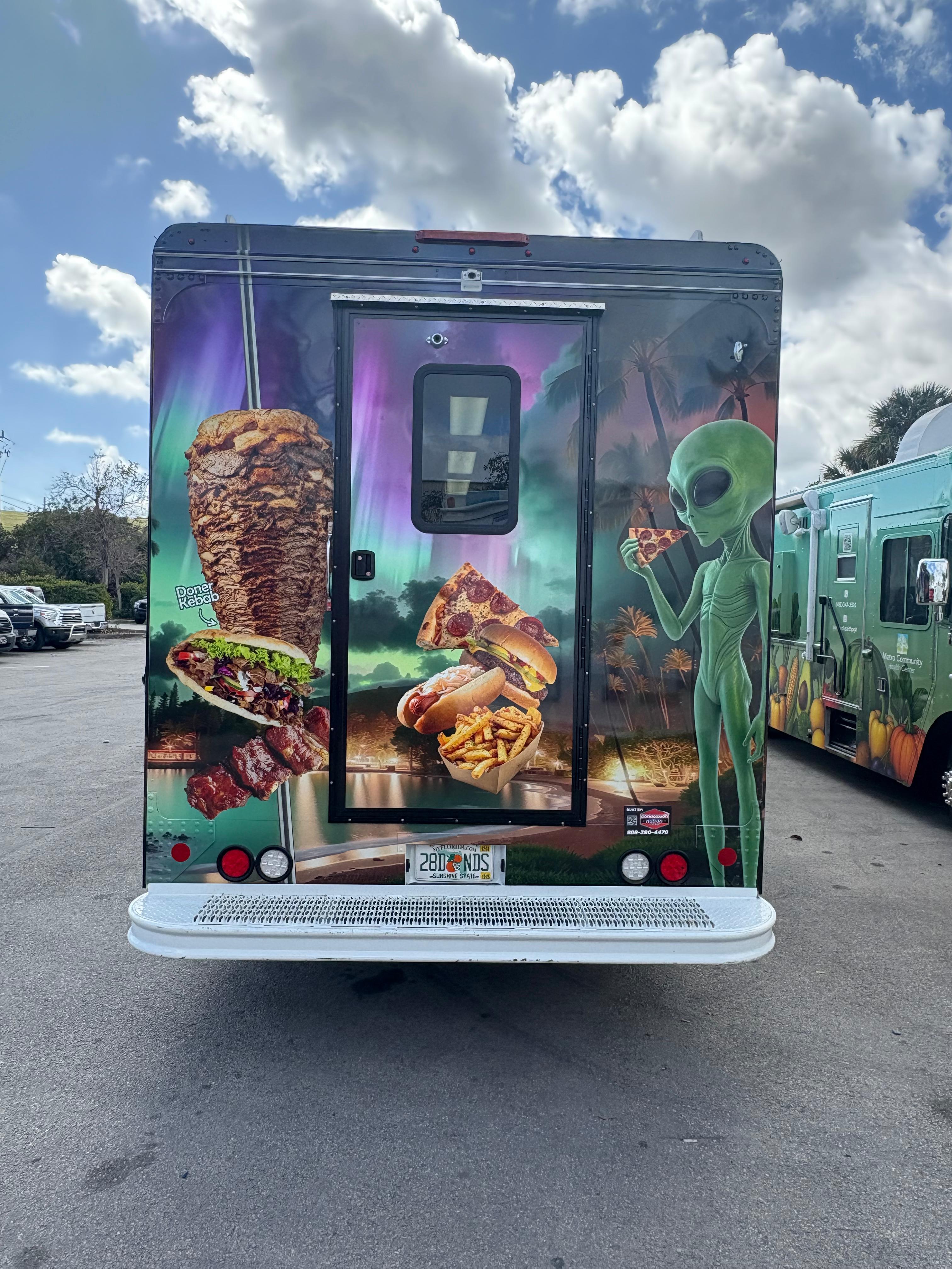 Custom food truck rear wrap with themed graphics